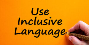 words Use Inclusive Language in black on orange background